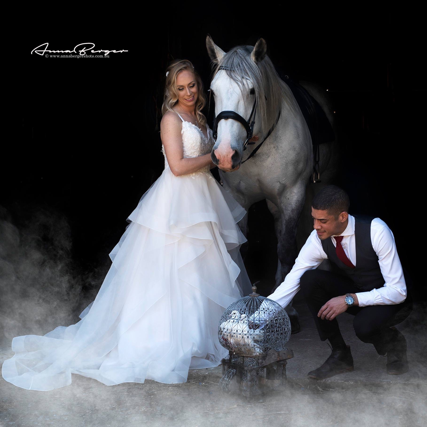bride and groom with horse